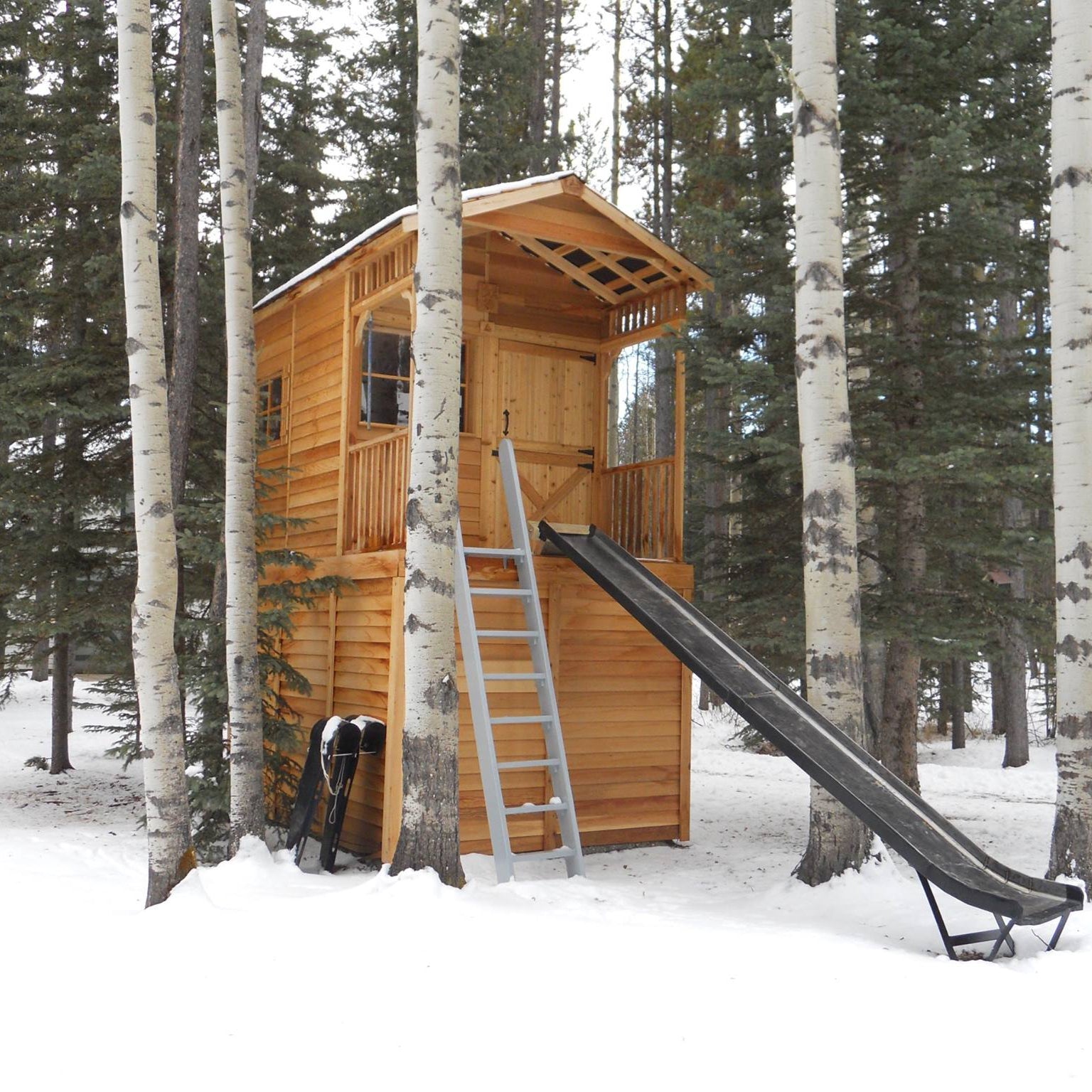 raised clubhouse with slide