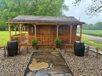 cedar shed with covered porch and railings