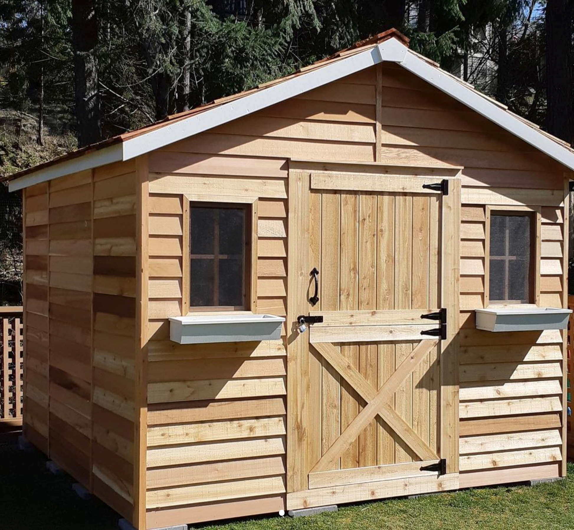 cedar cabin with dutch door and window boxes